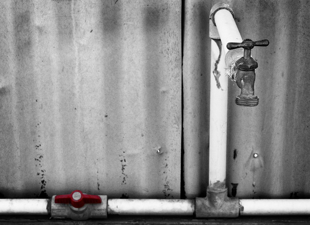 A photo of a water spigot, as shot by Flickr user rheinitz