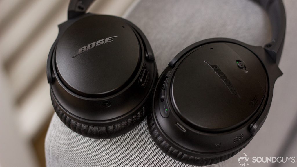 Pictured are the controls of the Bose QuietComfort 35 II with the headphones on a couch. 