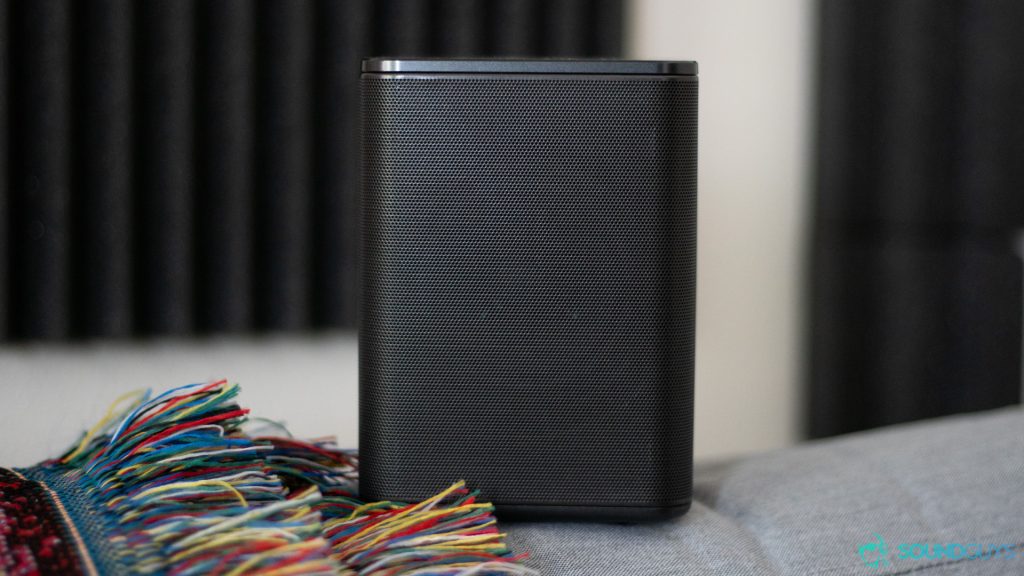 The optional surround speaker on the couch.