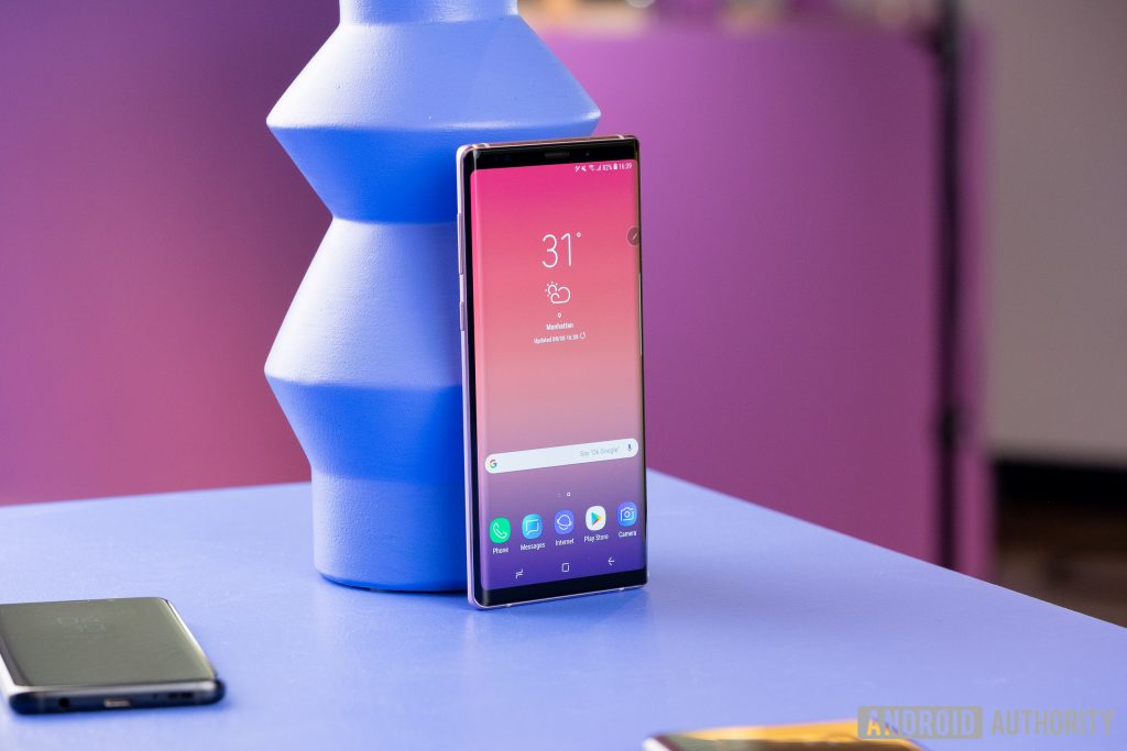 A picture of the Samsung Galaxy Note 9 against a geometric blue object.