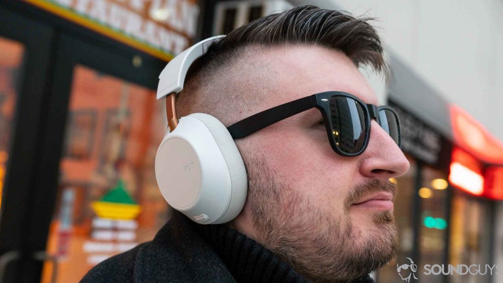 An picture of a man wearing the Plantronics Backbeat Go 810 over-ear headphones in white.