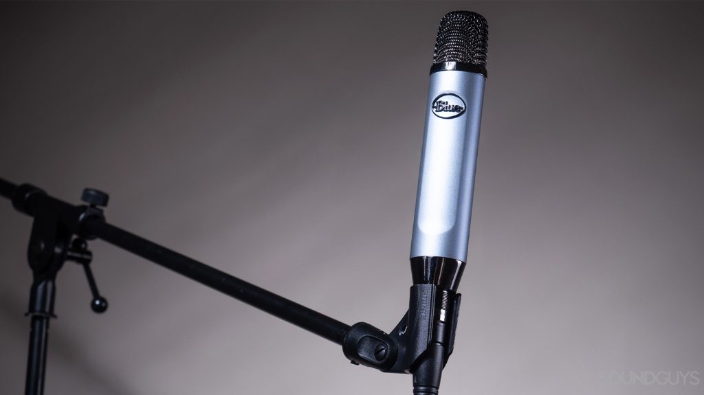 A picture of the Blue Ember XLR microphone, depicting the various microphone types, on a boom stand.