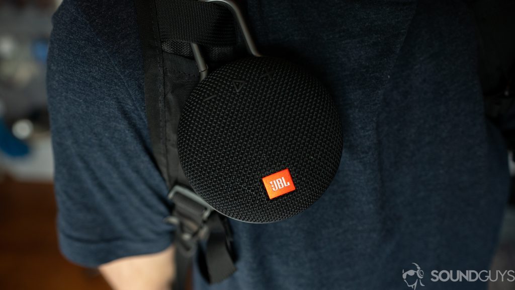 Pictured is the JBL Clip 3 attached to a backpack strap.