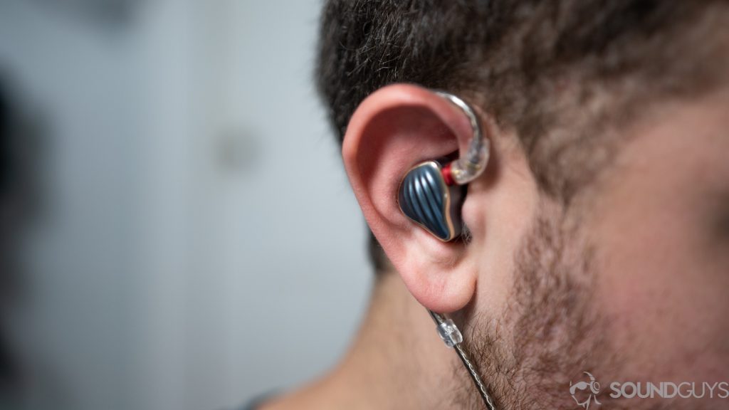 A picture of a man wearing the Fiio FH5 in-ears