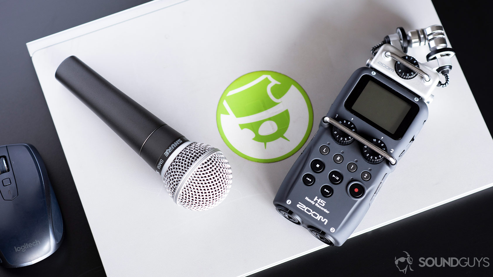 https://www.soundguys.com/wp-content/uploads/2019/08/Shure-SM58-1_aerial-XLR-microphone-Zoom-H5-voice-recorder.jpg