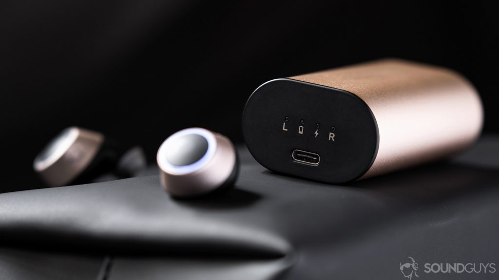 An image of the Creative Outlier Air earbuds in front of the charging case with the USB-C input in focus.
