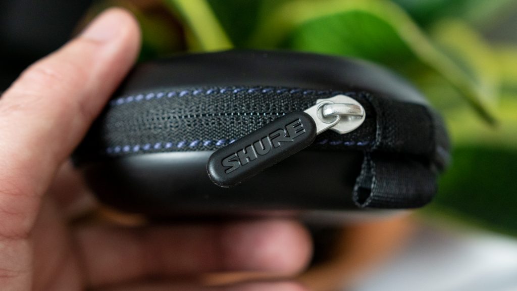 The zipper on the Shure Aonic 215 charging case.
