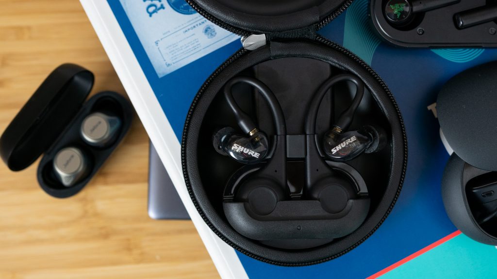 The Shure Aonic 215 true wireless earbuds charging case next to other true wireless earbud cases.