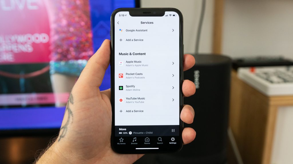 Shot of the Sonos app running on an iPhone 11 Pro in hand