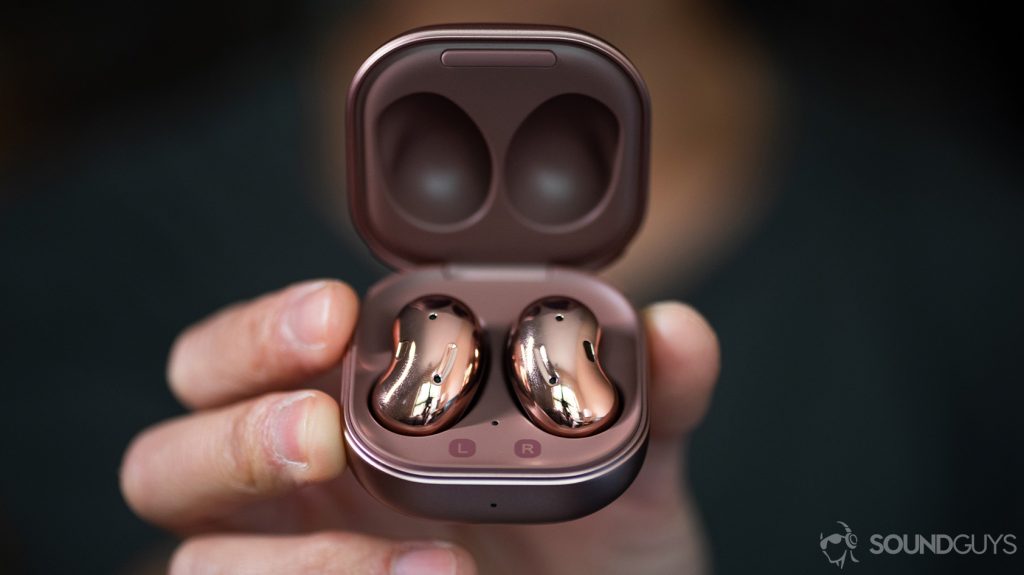 A picture of the Samsung Galaxy Buds Live noise cancelling true wireless earbuds in the case being held in a hand.