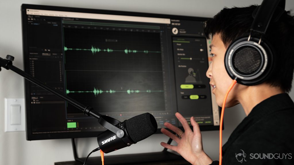 A woman speaks into the Shure MV7 USB microphone as it records into Adobe Audition.