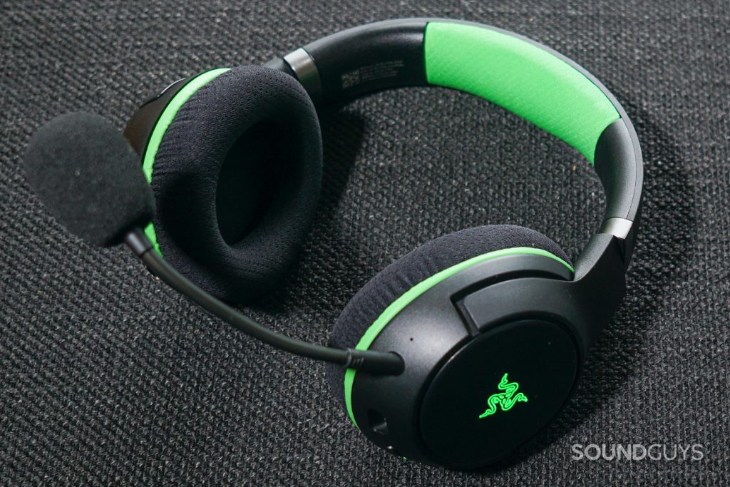 The Razer Kaira Pro gaming headset lays on a fabric surface.