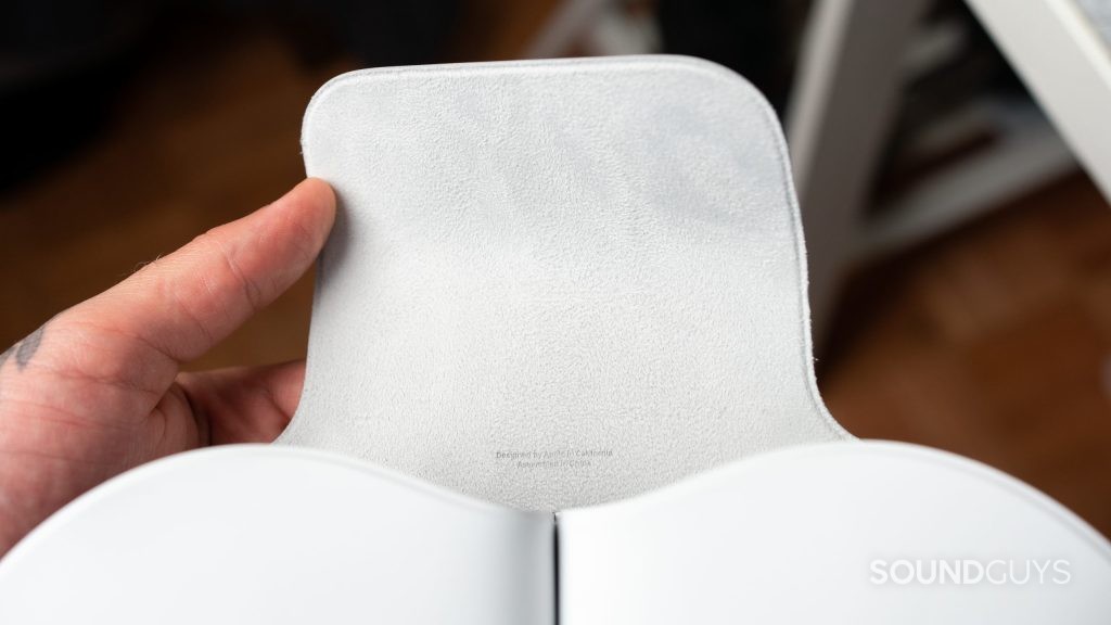 Man holding the smart case for the Apple AirPods Max.
