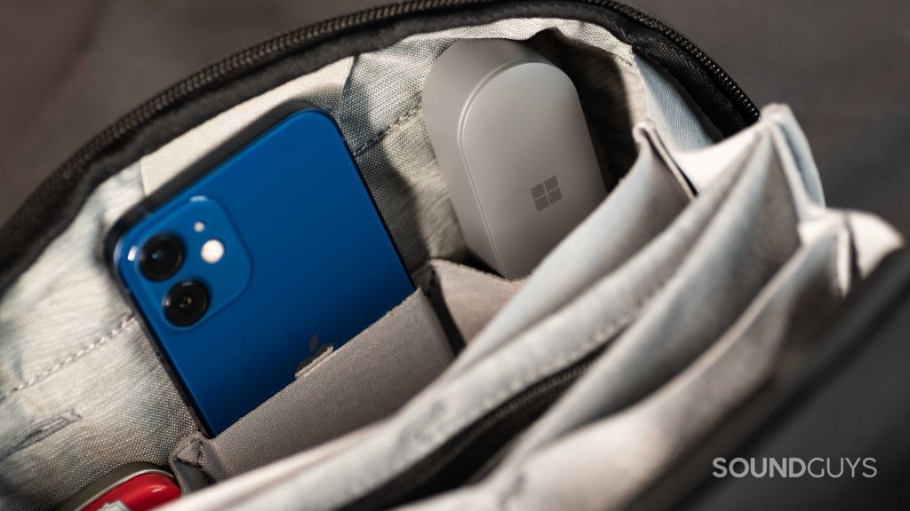 The Microsoft Surface Earbuds case in a zippered travel pouch.