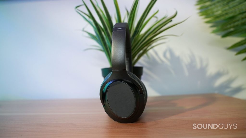 The Monoprice-BT-600 ANC noise cancelling Bluetooth headphones in front of a house plant.