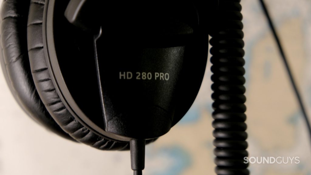 The Sennheiser HD 280 Pro studio headphones logo and coiled cable.