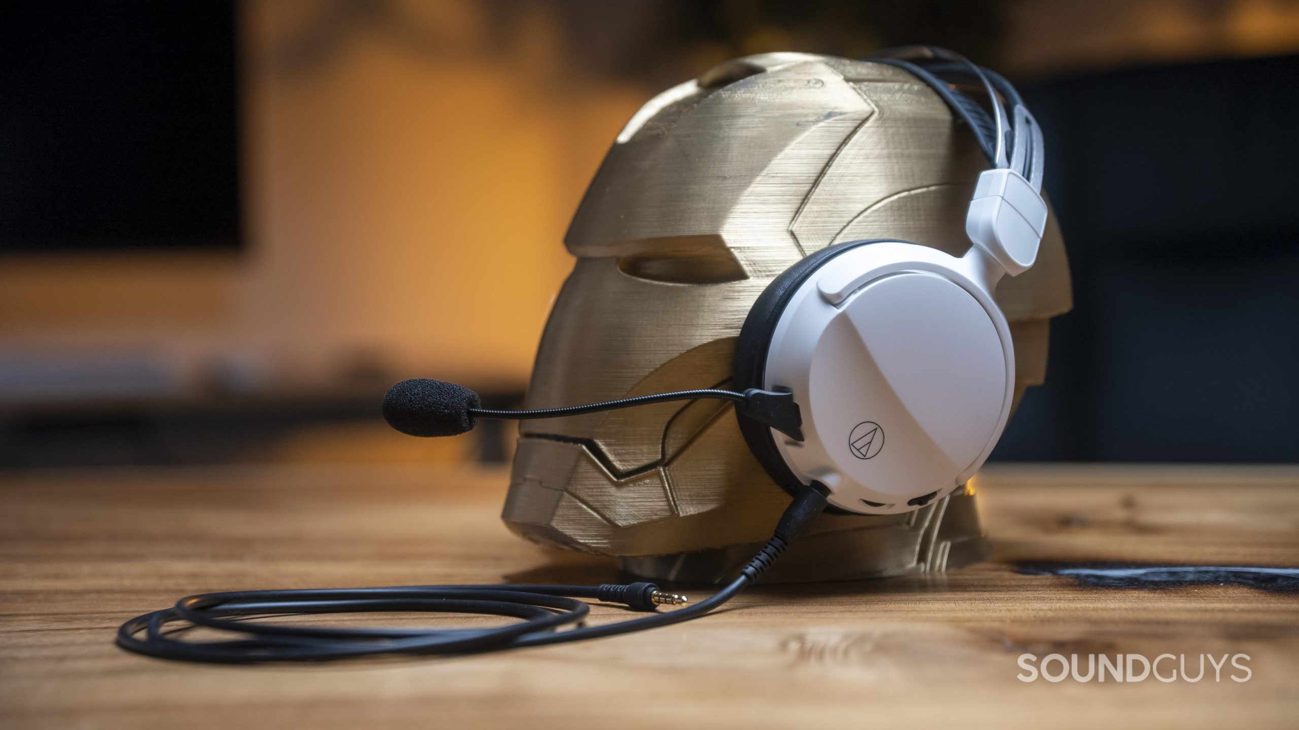 The Audio-Technica ATH-GL3 gaming headset adorns an wooden Iron Man head.