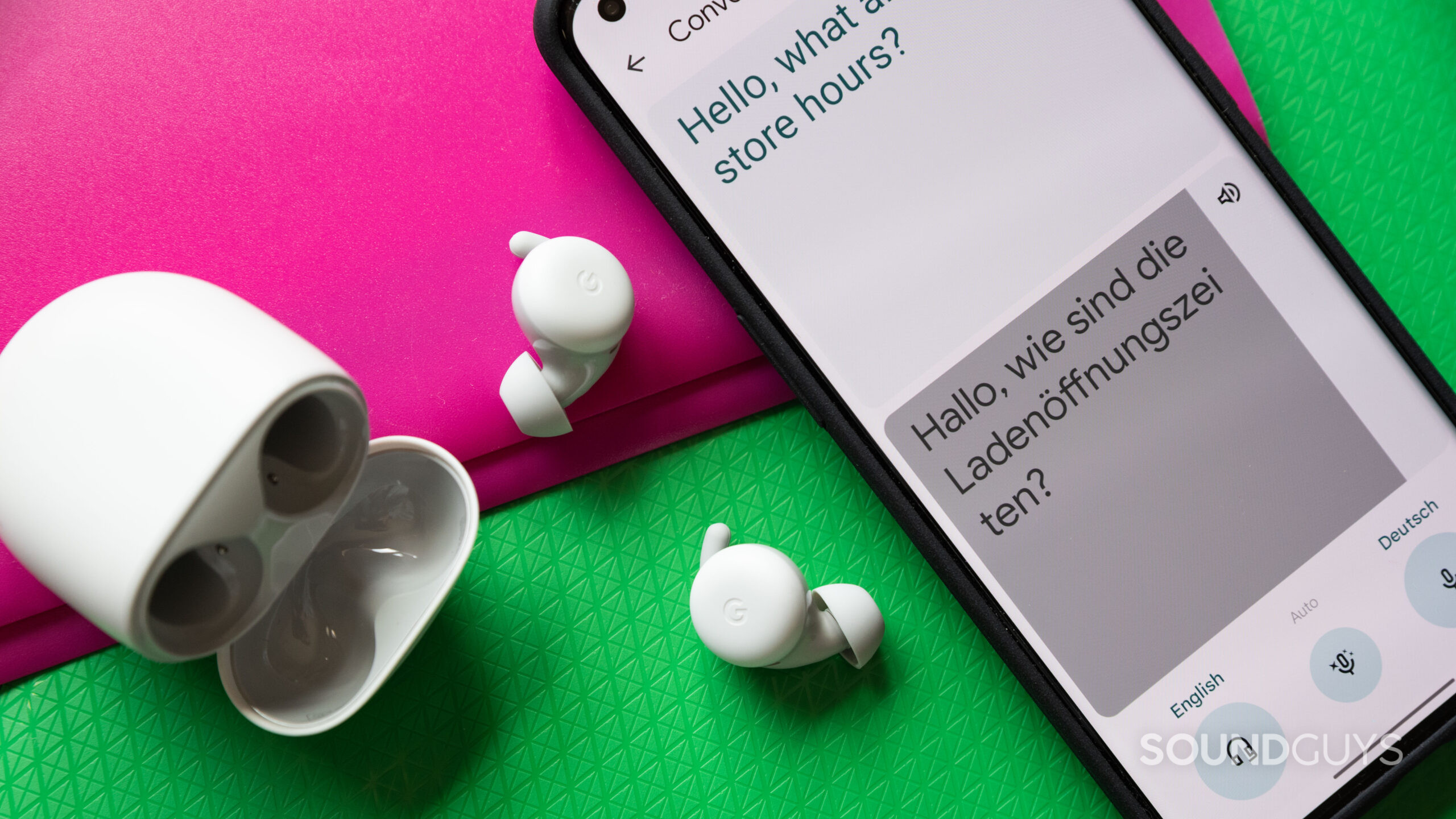 The Pixel Buds A-Series next to a Pixel 6 phone.