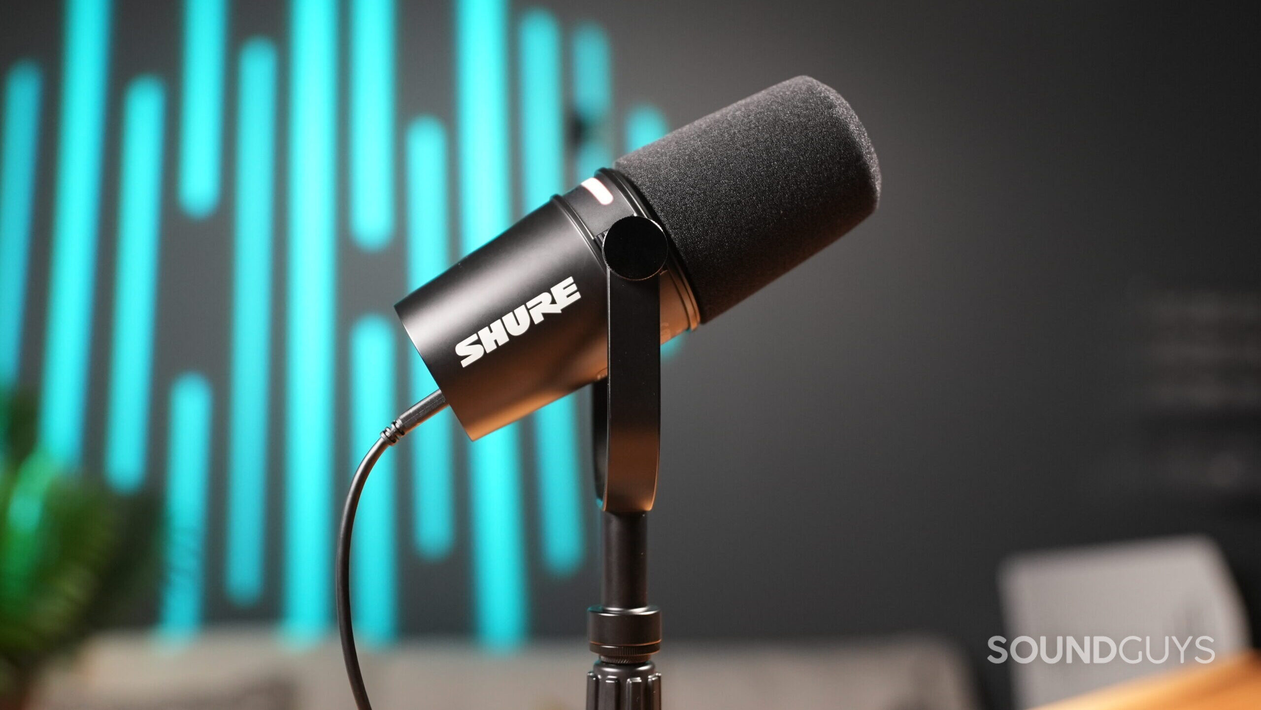 Side shot of the Shure MV7+ microphone on a stand