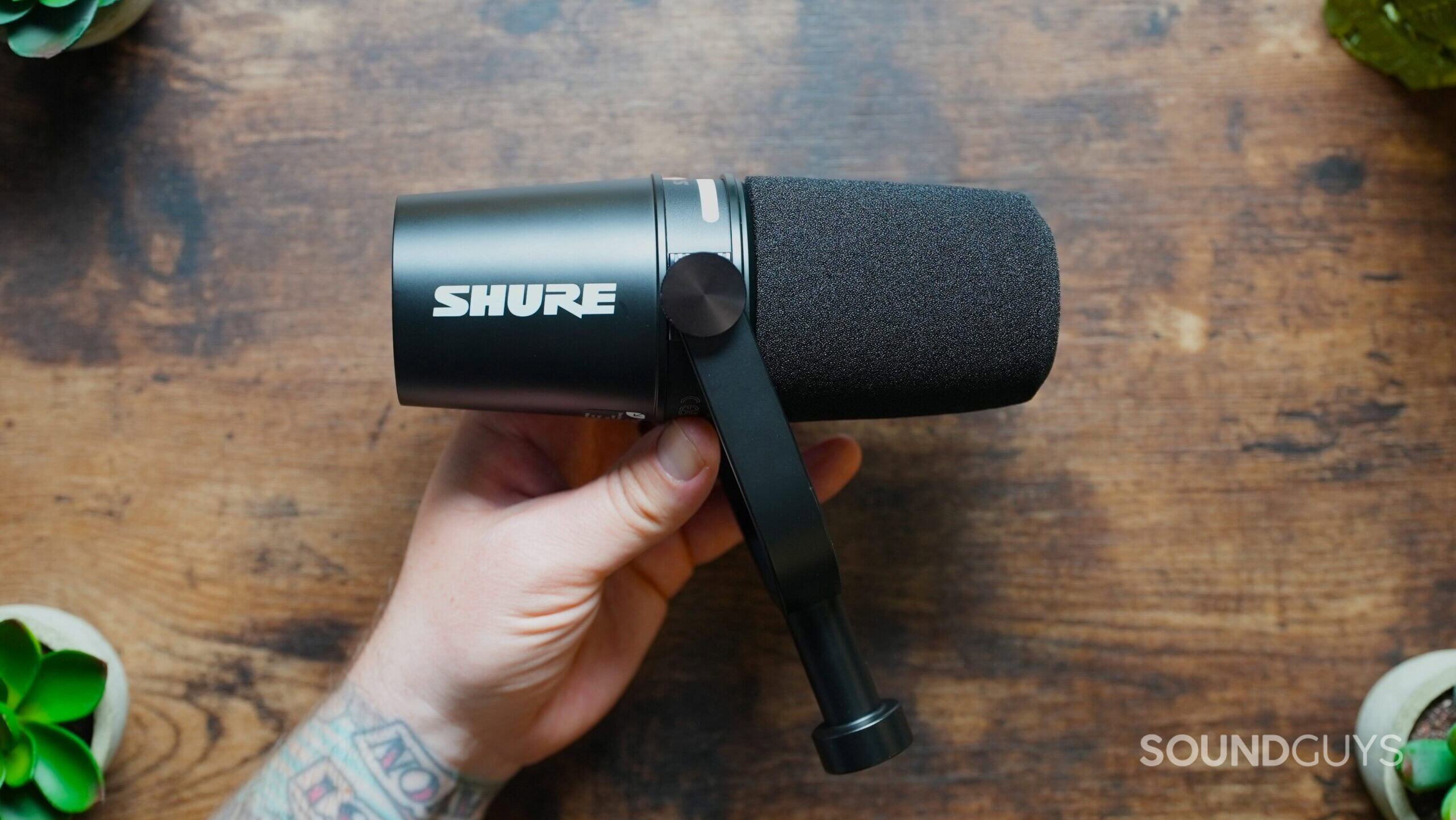 Top down shot of the Shure MV7+ in hand.