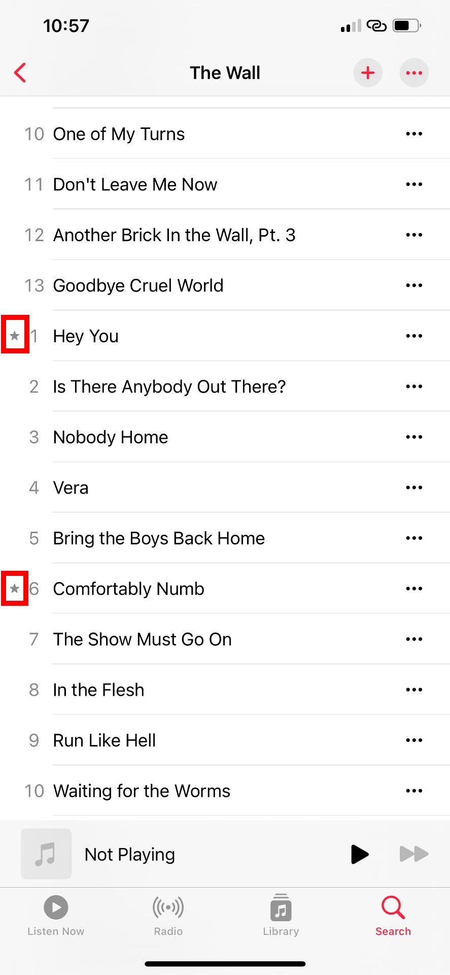 Apple Music album showing tracks with star icons