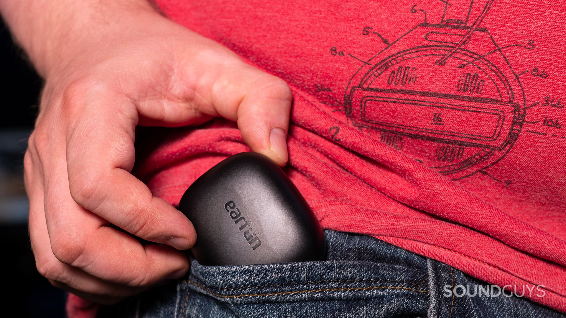 A photo of the EarFun Air Pro 3 being stuffed into a man's jeans pocket.