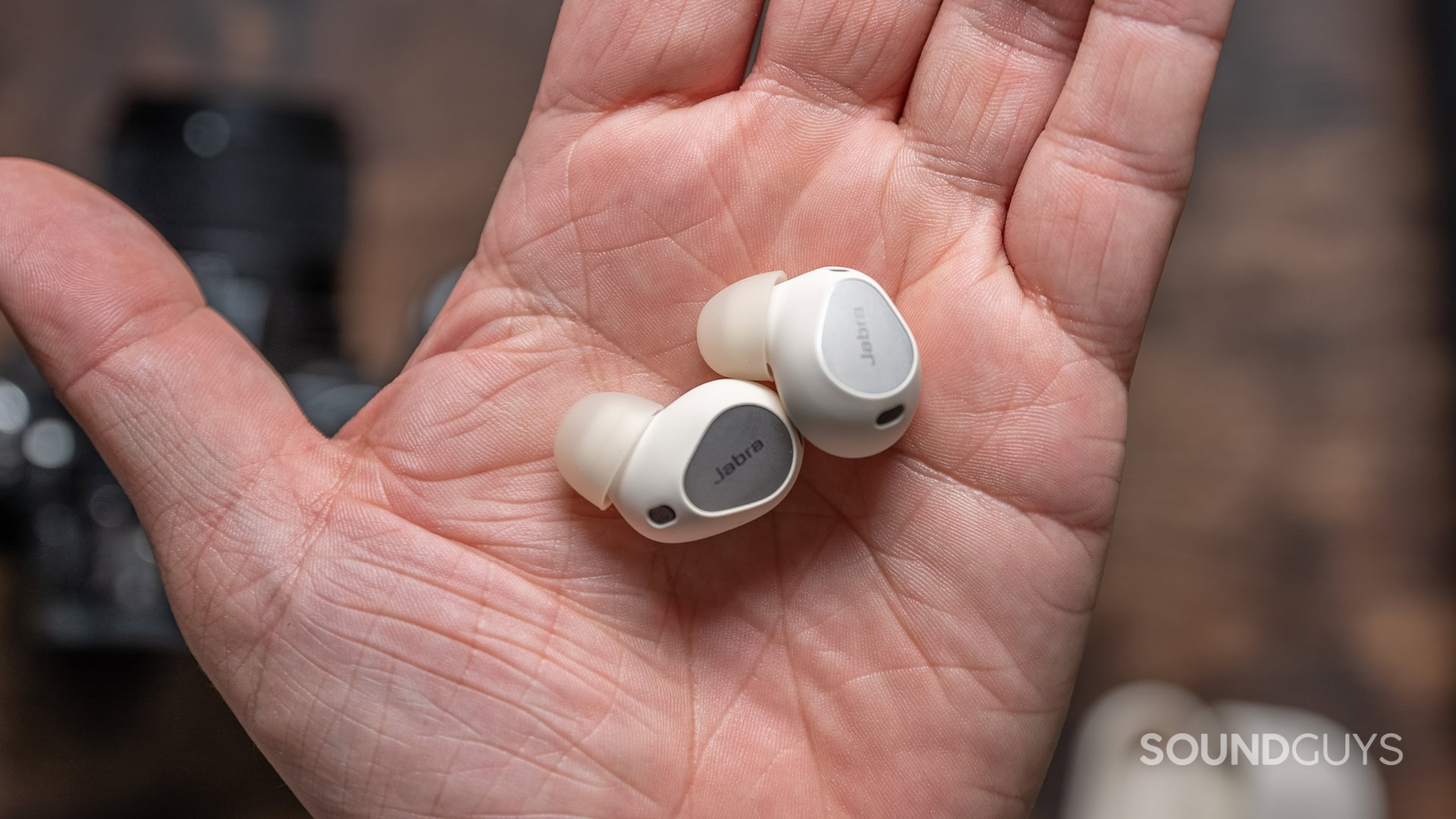 A photo of the Jabra Elite 10 Gen 2 earbuds being held in a hand.