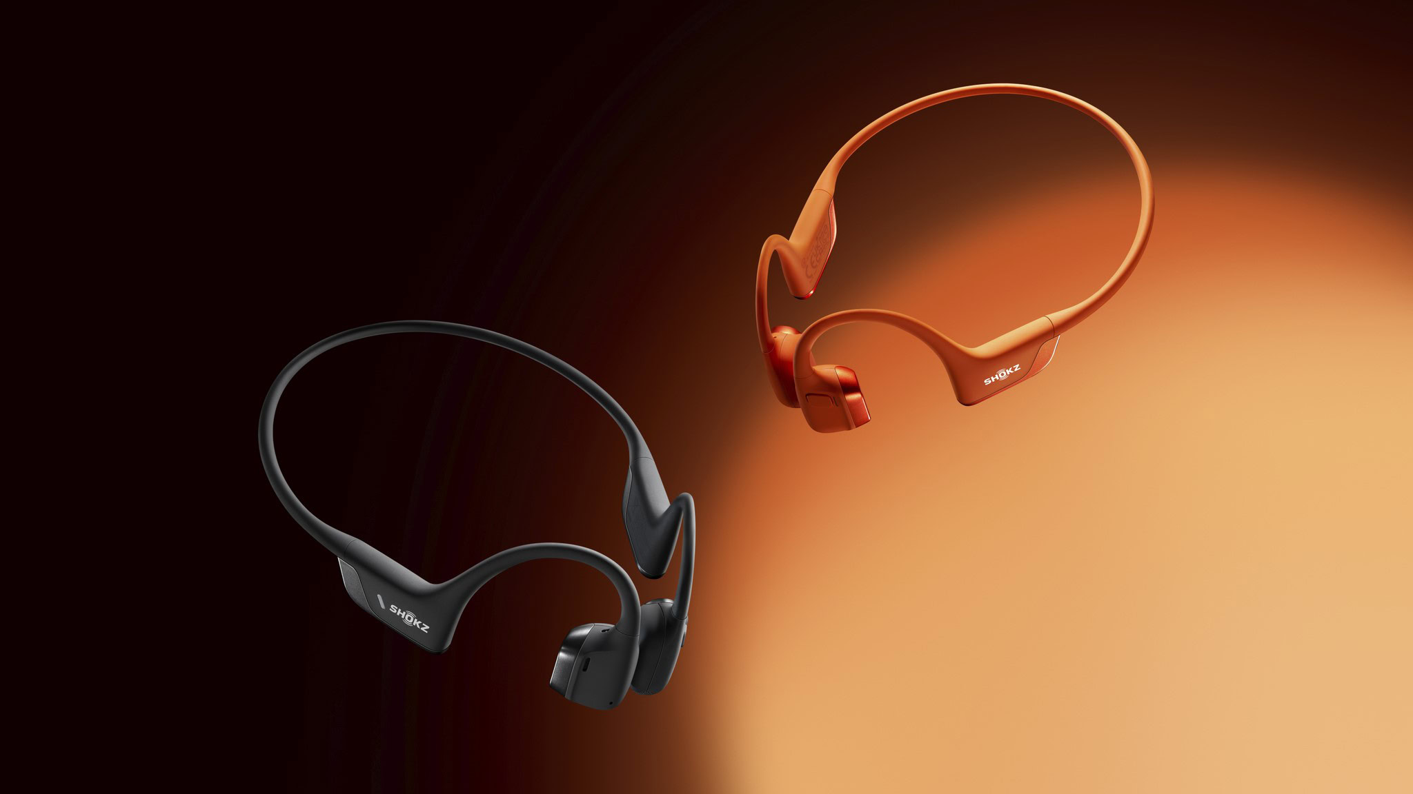 shokz openrun pro 2 bone conduction headphones in black and orange