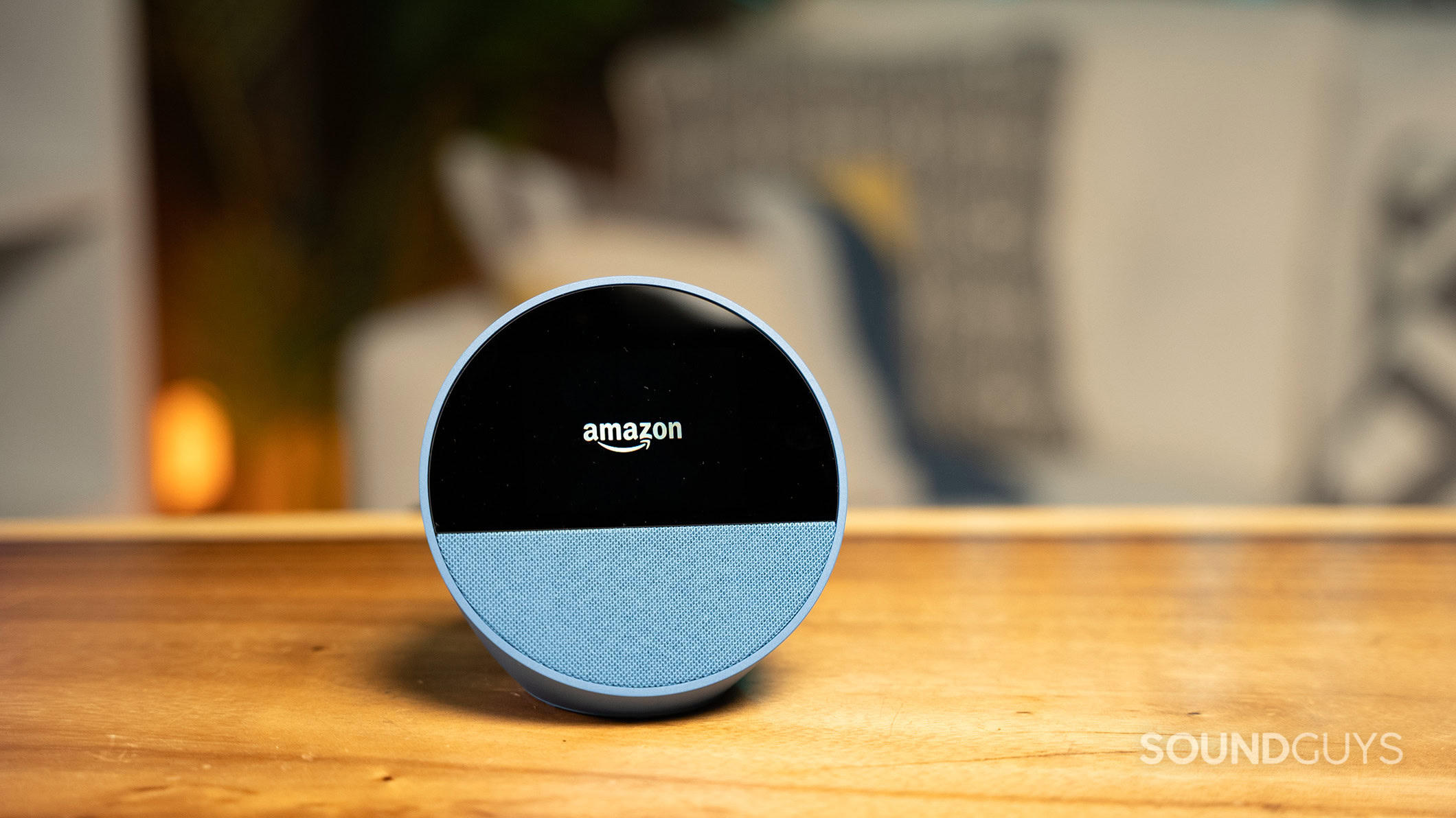 The Amazon Echo Spot (2024) on a table displaying the Amazon logo. 