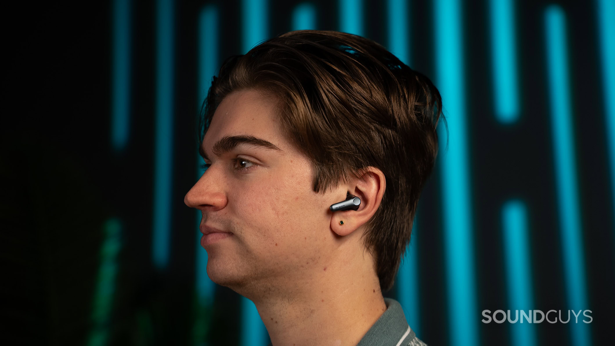 A man wearing the EarFun Air Pro 4 earbuds. 