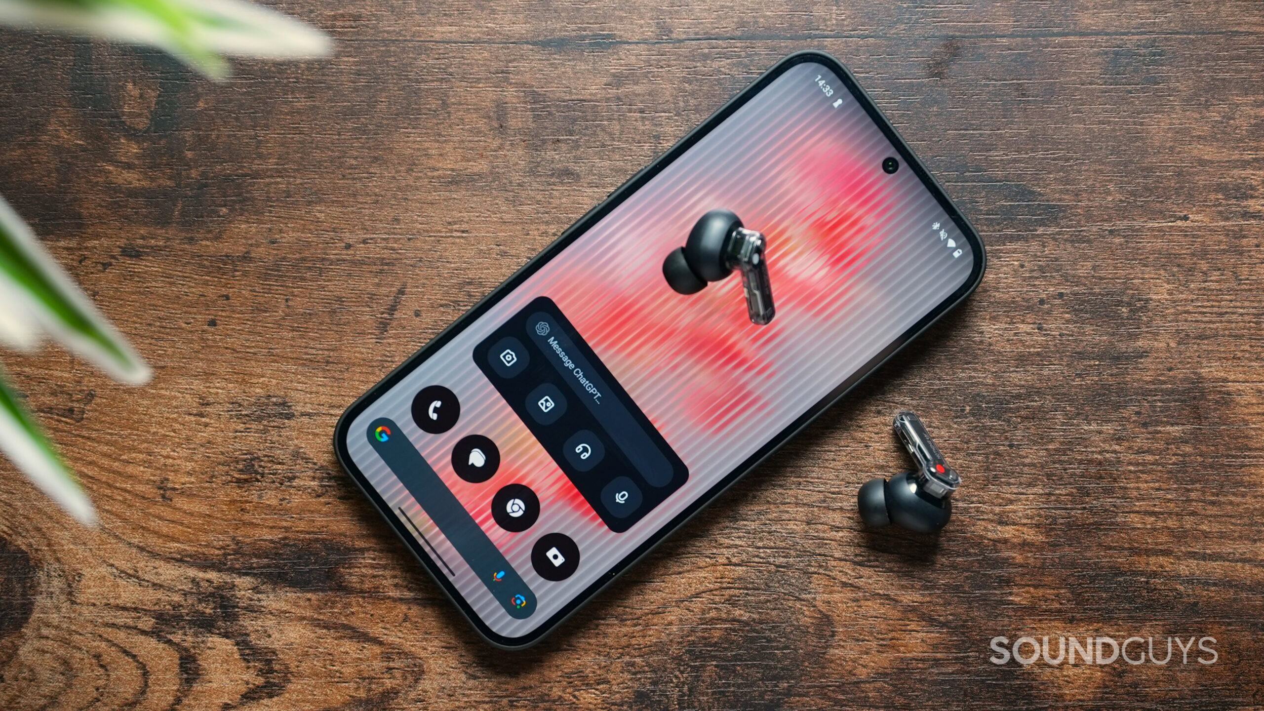 Nothing Phone 2(a) with ChatGPT widget on screen and Nothing Ear earbuds
