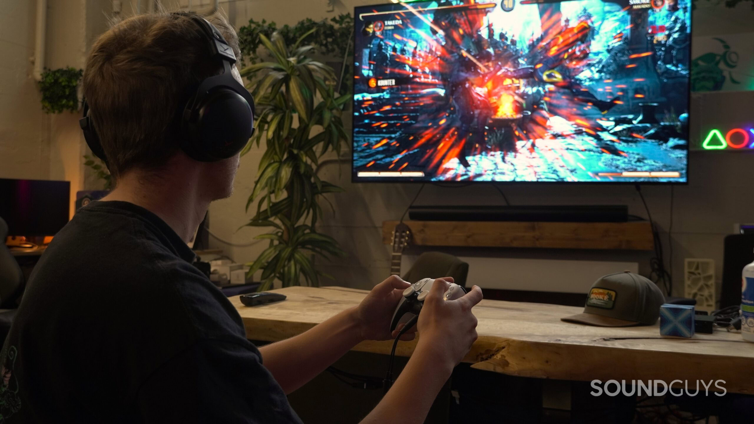 a man wearing headphones playing video games