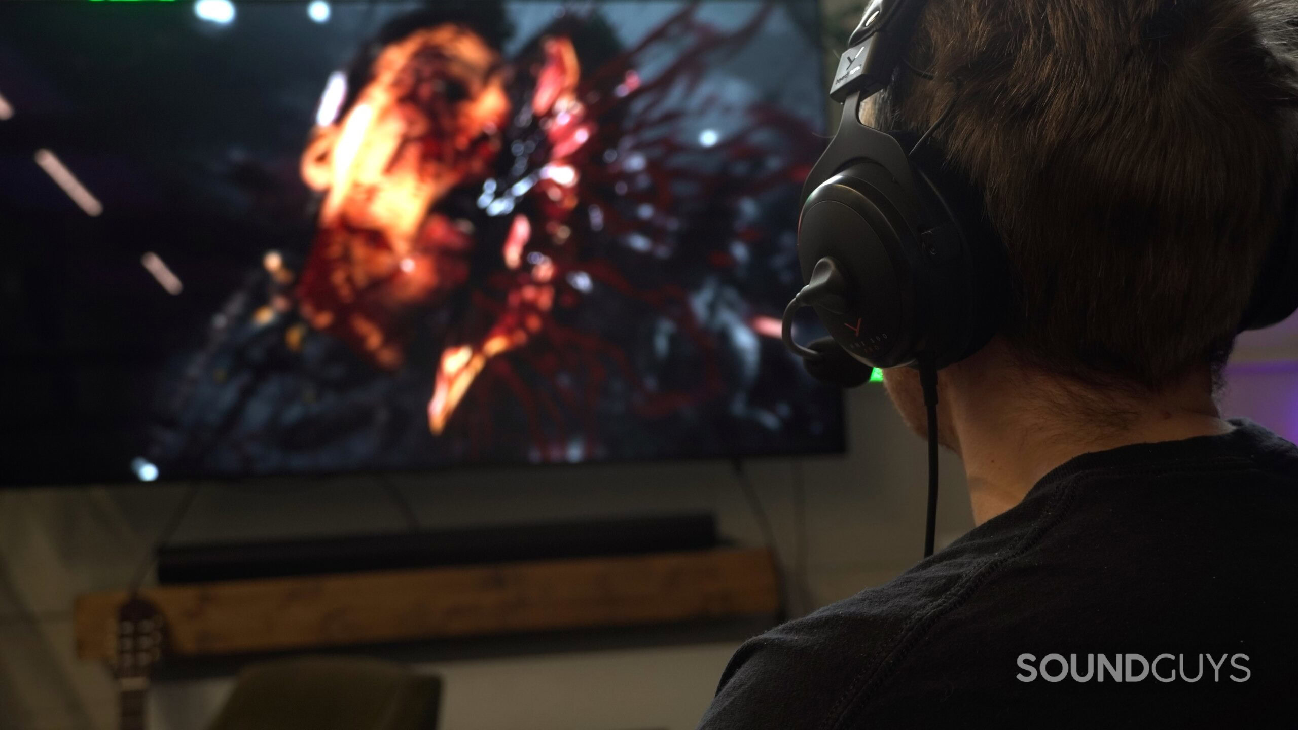 a man wearing headphones while playing video games