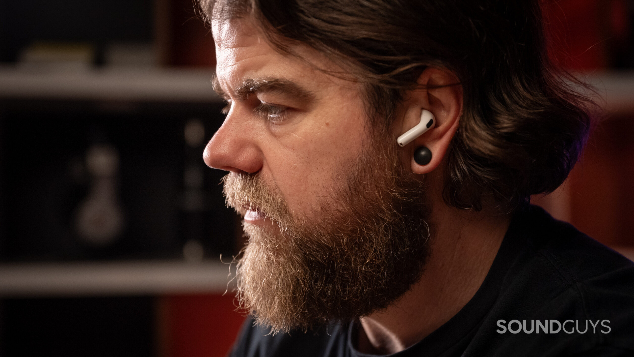 a man wearing the airpods 4