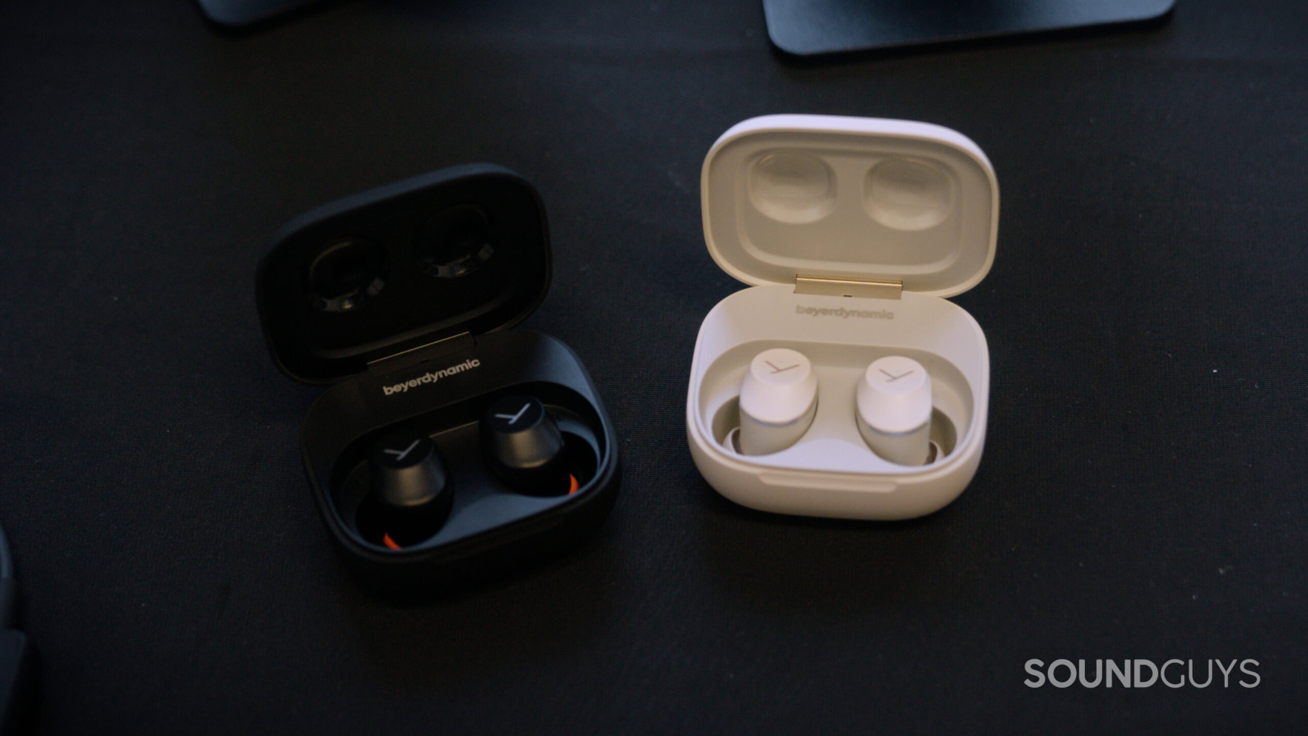 Beyerdynamic AMIRON 300 earbuds on a table.