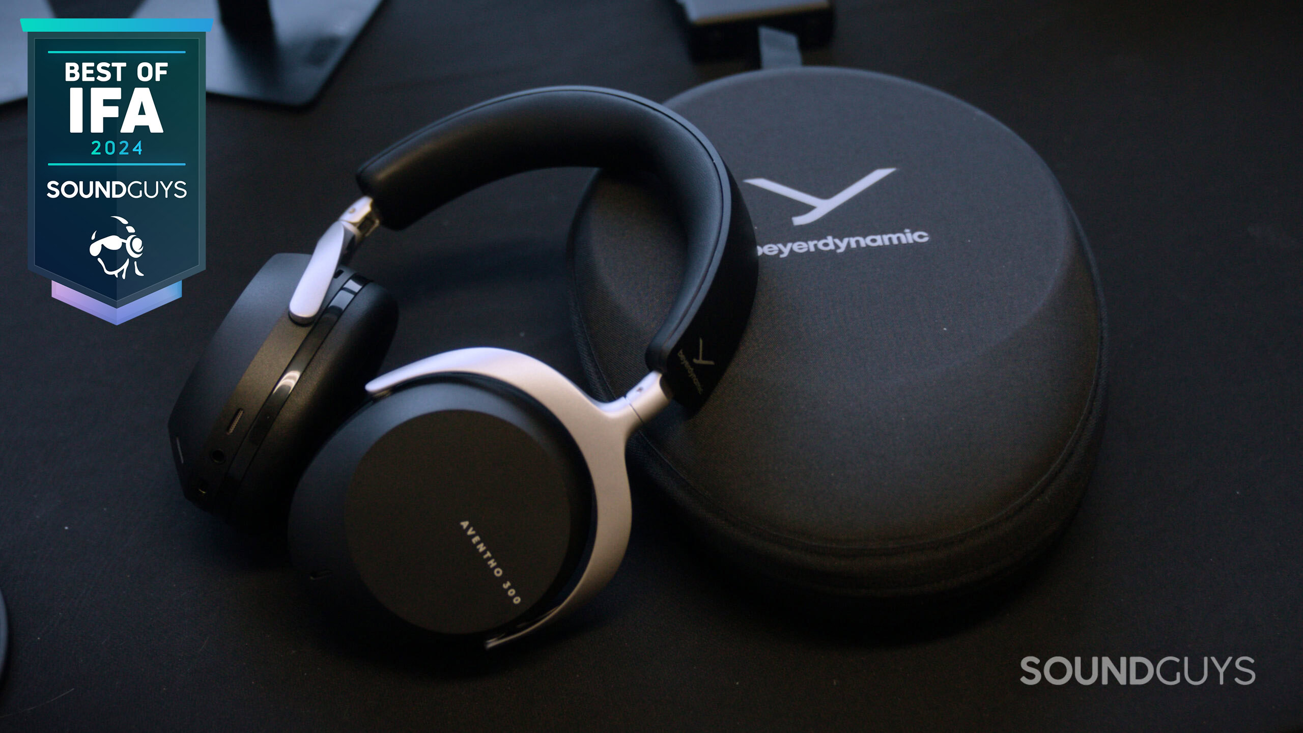 Beyerdynamic AVENTHO 300 headphones next to their carrying case.