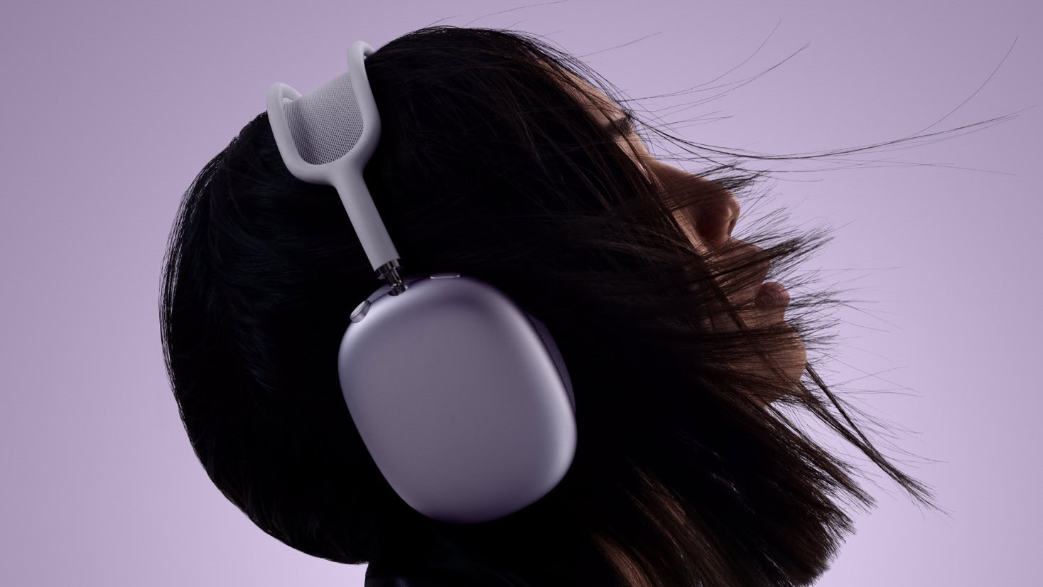 a women wearing the purple airpods max