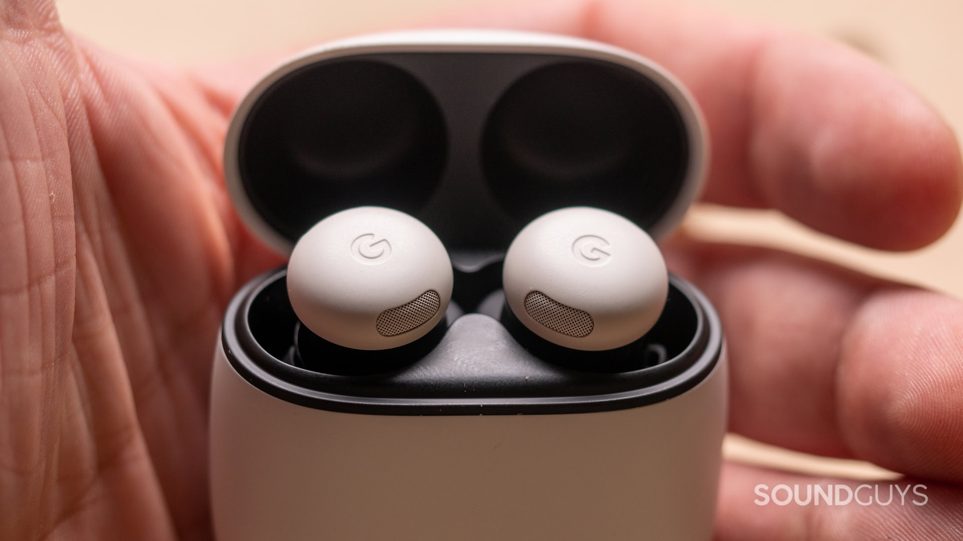 A close up photo of the Google Pixel Buds Pro 2 in someone's hand.