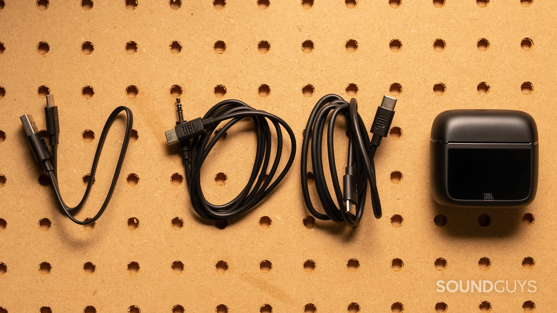 A photo of all the cables included with the JBL Tour Pro 3.