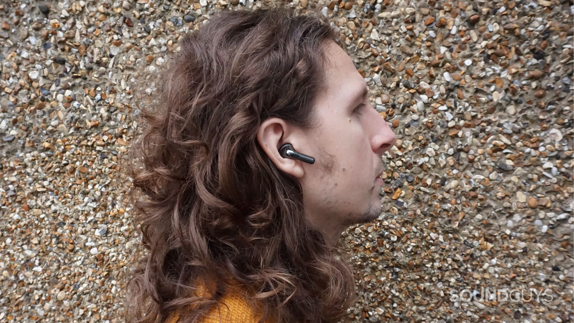 A photo of the OnePlus Buds Pro 3 earbuds being worn.