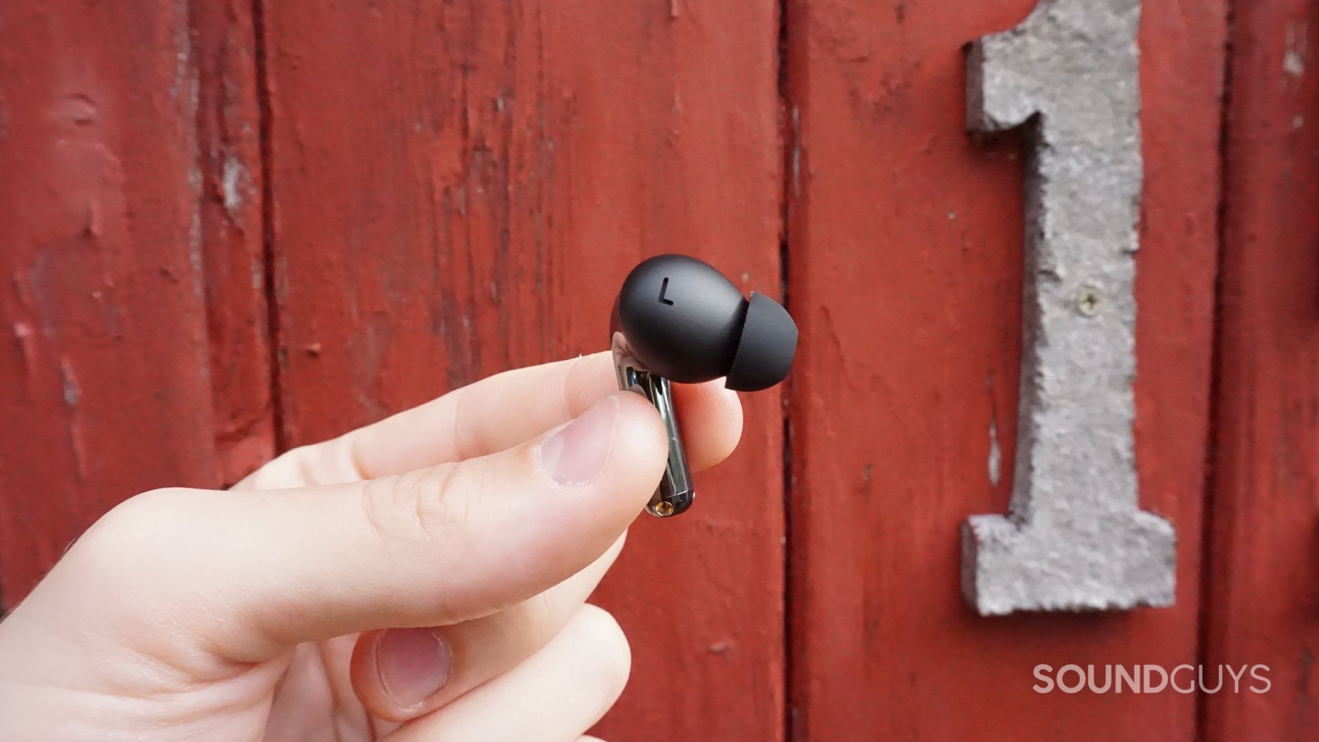 A closeup photo of the OnePlus Buds Pro 3 left earbud.