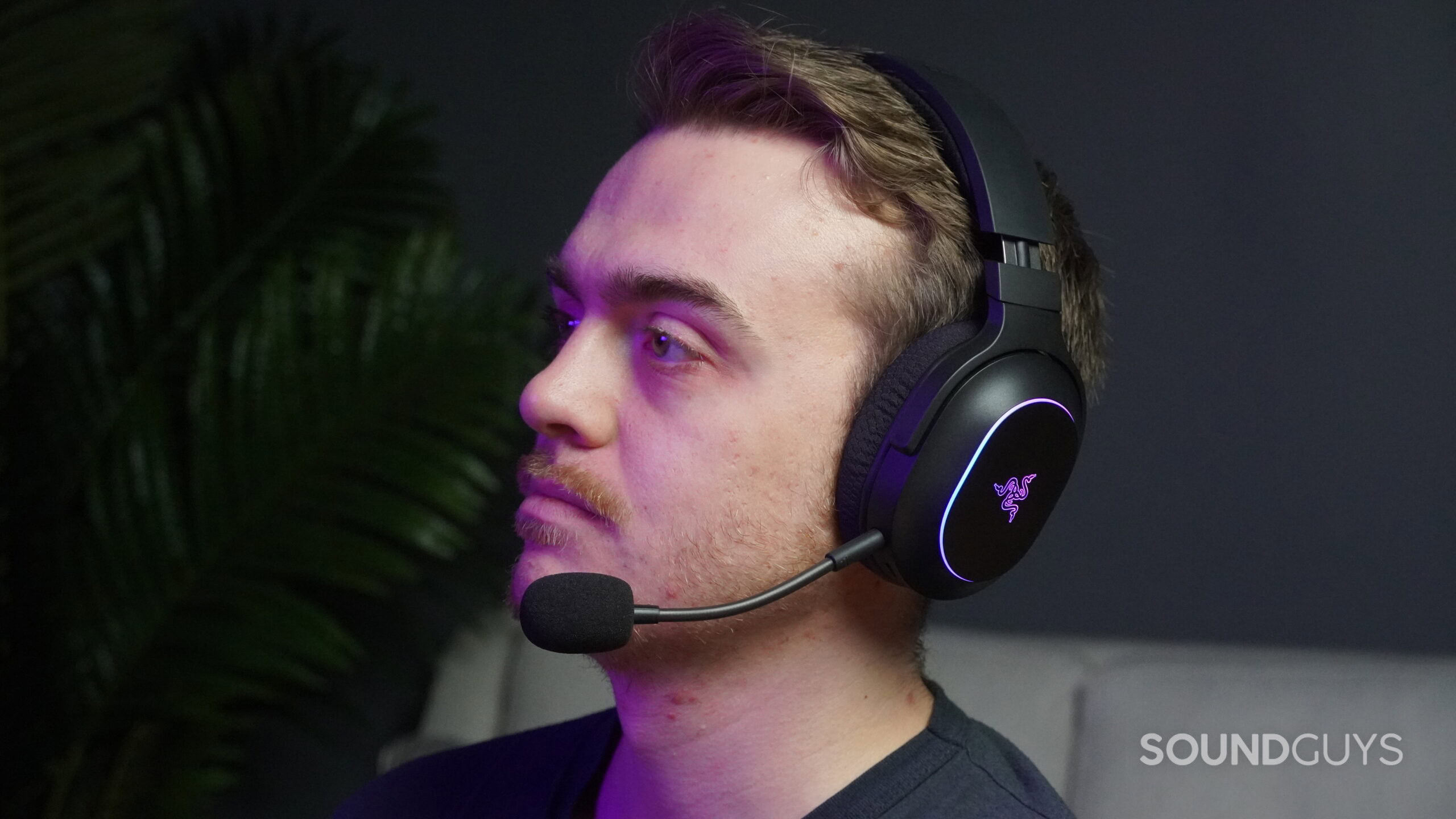 a man wearing the razer barracuda x chroma