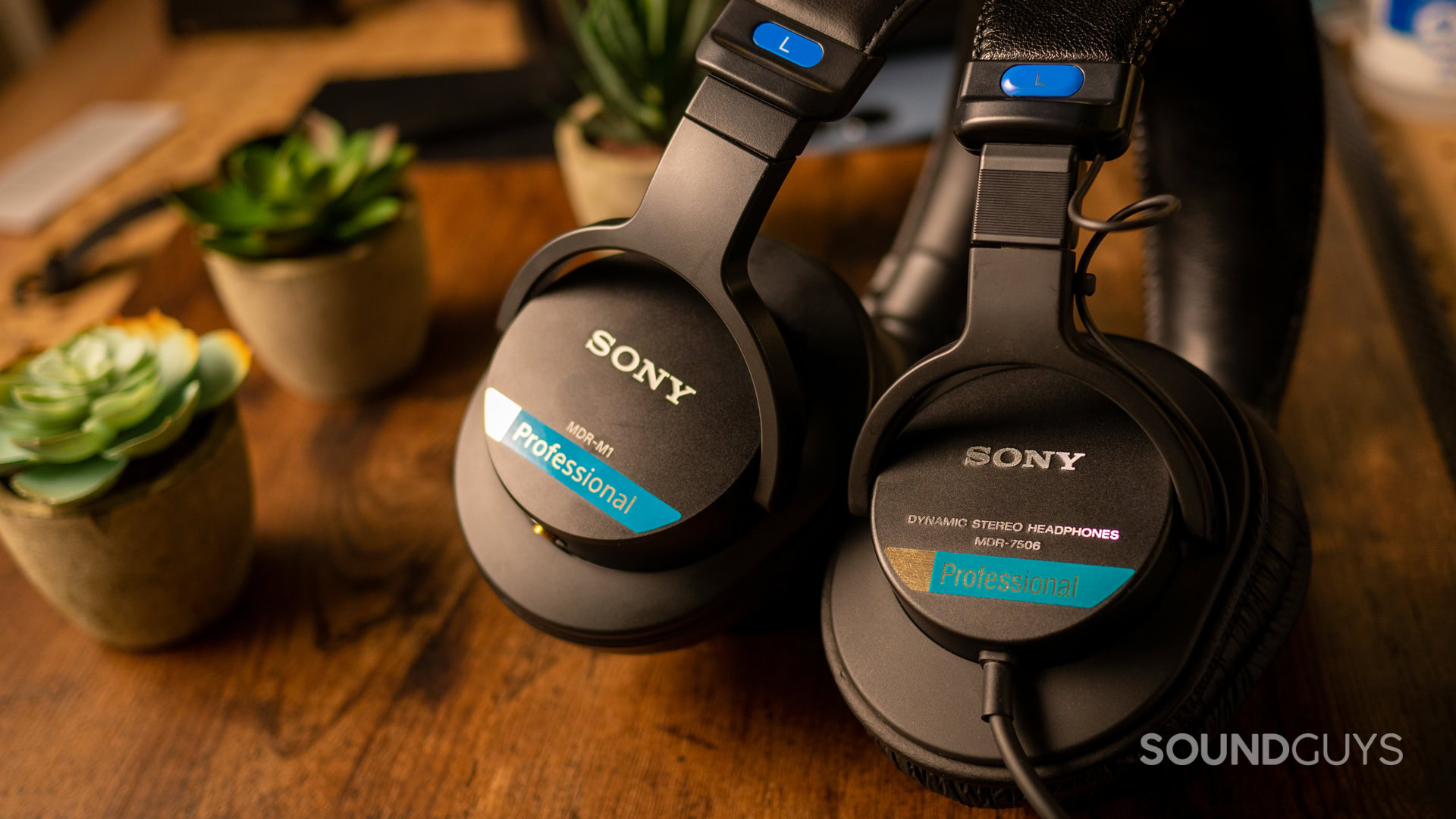 A photo of the Sony MDR-M1 next to the Sony MDR-7506.