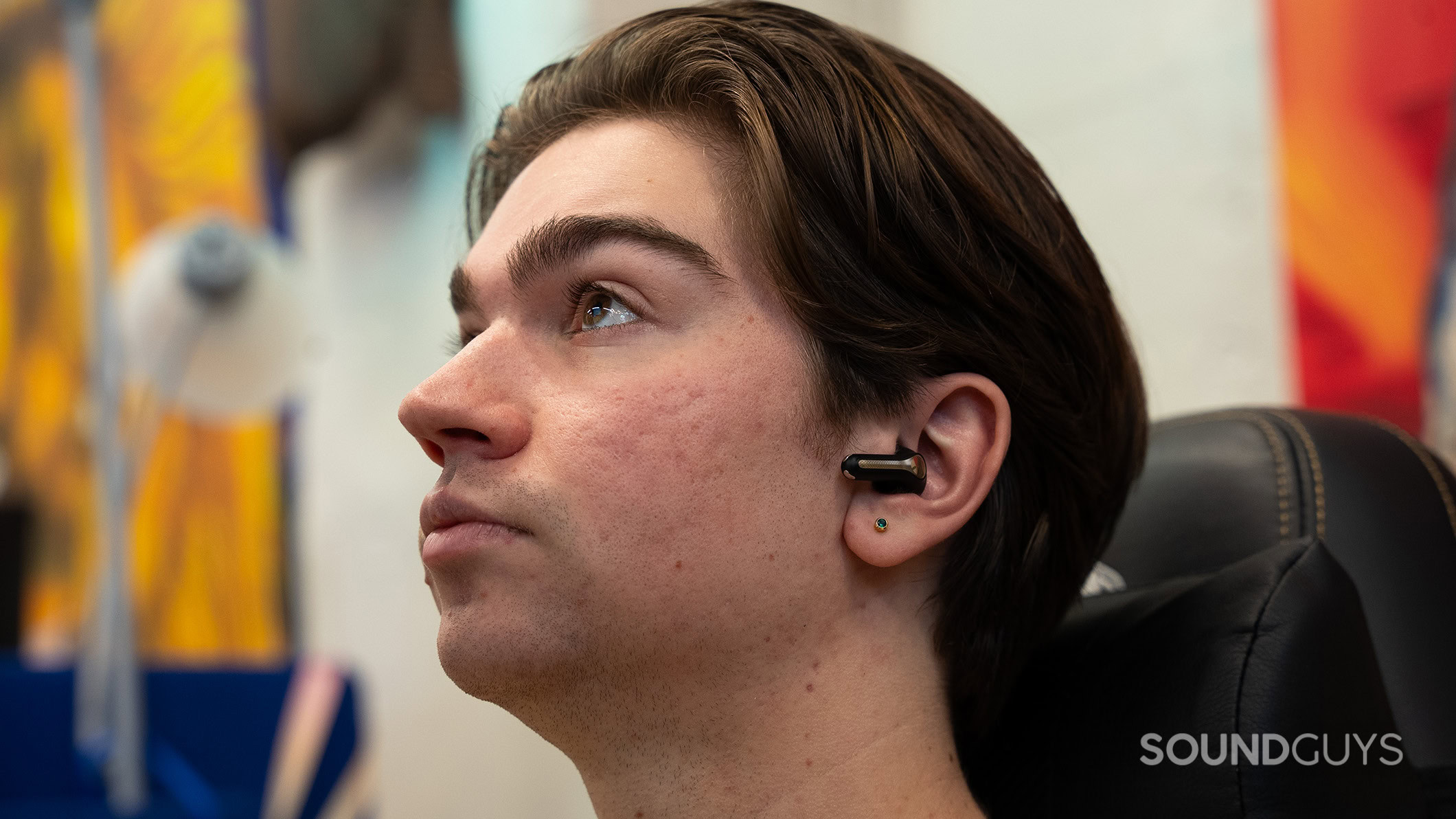 A man wearing the SoundPEATS Capsule3 Pro+ earbuds. 