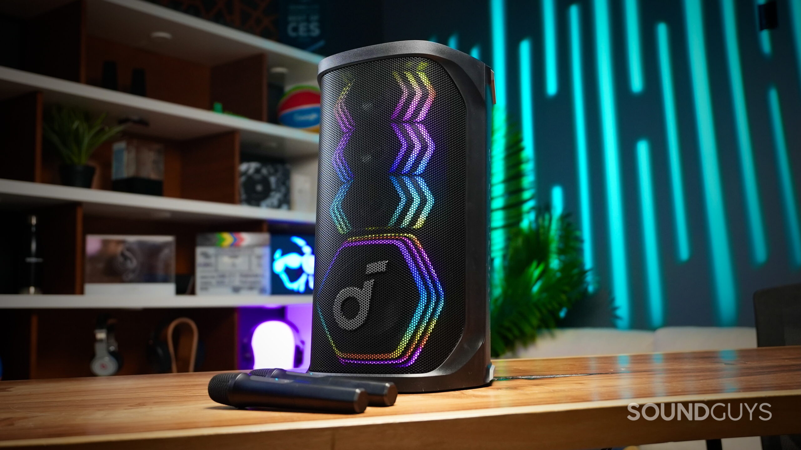 The Rave 3S speaker with party lights engaged, sitting on a table in a nice looking room.