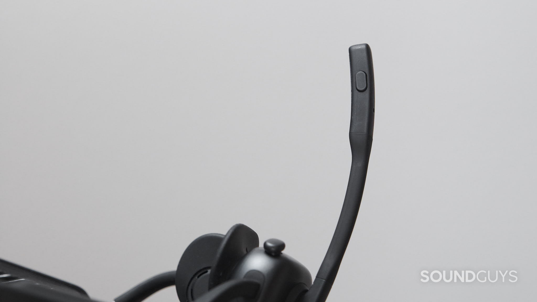 The Shokz OpenMeet UC microphone button.