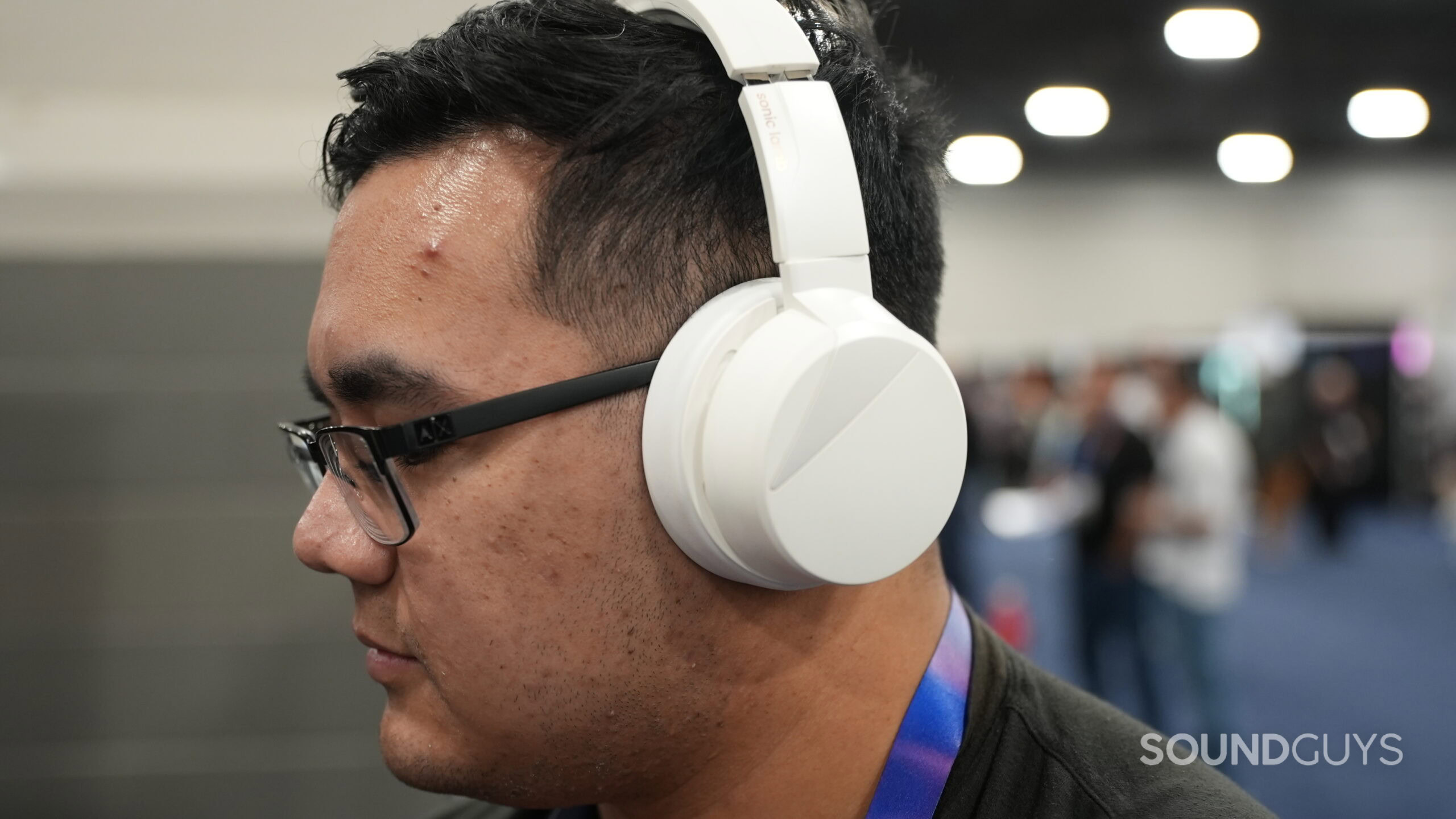 A man wearing the Sonic Lamb headphones.