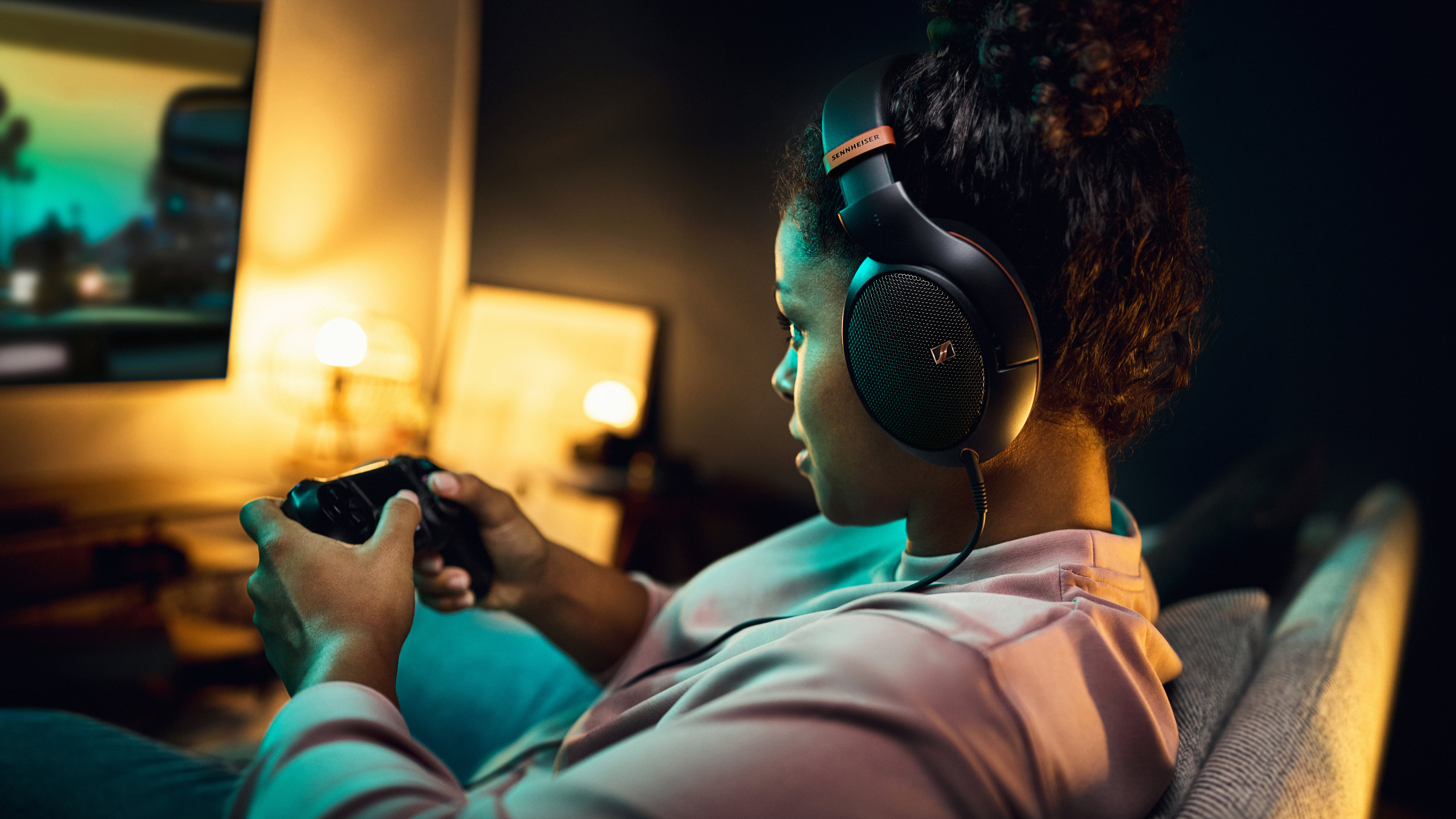 a woman wearing the sennheiser hd 505 while gaming